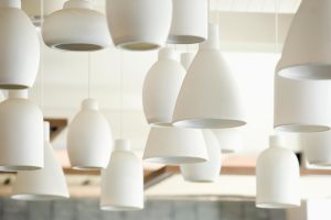 White lighting fixtures | Featured image for How Interior Light Fixtures Can Elevate Your Home blog for Latched Electrical Solutions.